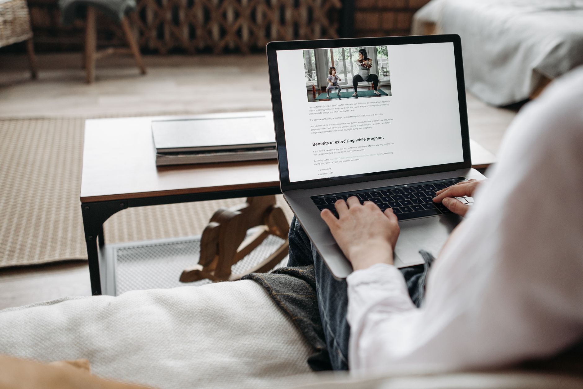 Ilustrasi: Person working remotely on a laptop in a cozy home setting, emphasizing comfort and technology.