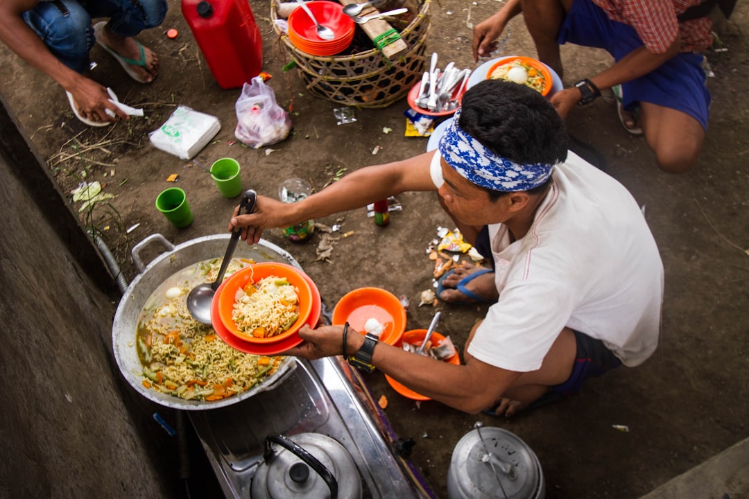 Ilustrasi: A man cooking food on a stove